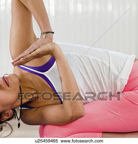 Stock Photography - Yoga balasana twist. Fotosearch