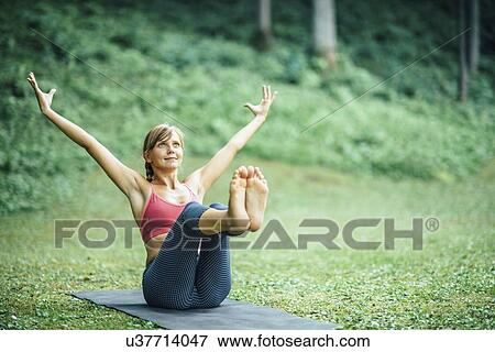 Yoga boat pose View Large Photo Image Stock Photo - Yoga boat pose. Fotosearch