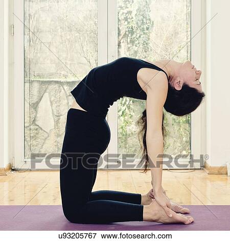 Stock Photo - Yoga camel pose. Fotosearch