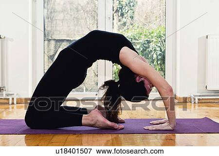 Stock Photo - Yoga camel position. Fotosearch