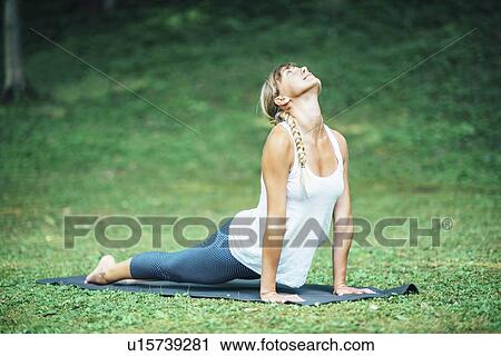 Yoga cobra position View Large Photo Image Stock Image - Yoga cobra position. Fotosearch