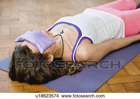 Yoga corpse pose View Large Photo Image Picture - Yoga corpse pose. Fotosearch