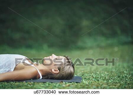 Yoga corpse pose View Large Photo Image Stock Image - Yoga corpse pose. Fotosearch
