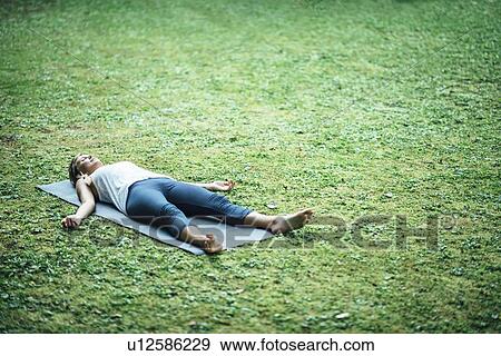 Yoga corpse pose View Large Photo Image Stock Photo - Yoga corpse pose. Fotosearch