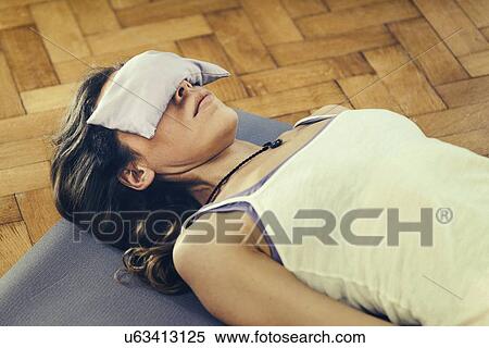 Stock Photography - Yoga corpse pose. Fotosearch
