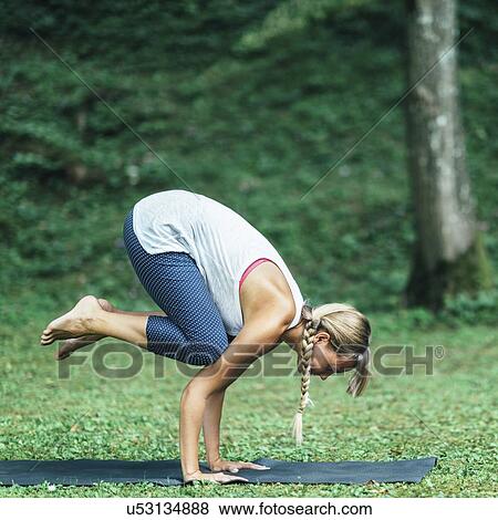 Yoga crow position View Large Photo Image Stock Photo - Yoga crow position. Fotosearch
