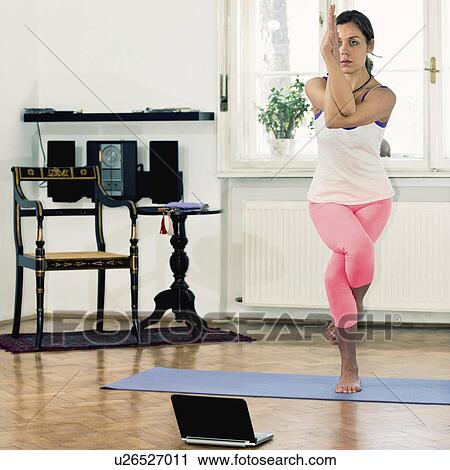 Yoga eagle position View Large Photo Image Stock Image - Yoga eagle position. Fotosearch