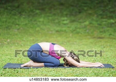 Yoga half tortoise position View Large Photo Image Stock Image - Yoga half tortoise position. Fotosearch