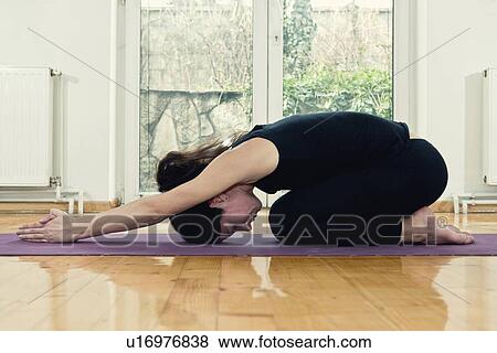 Yoga half tortoise position View Large Photo Image Stock Photo - Yoga half tortoise position. Fotosearch