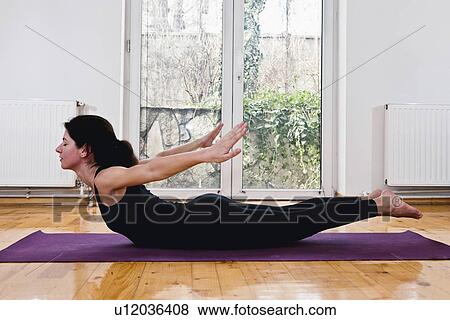 Yoga locust position View Large Photo Image Stock Photo - Yoga locust position. Fotosearch
