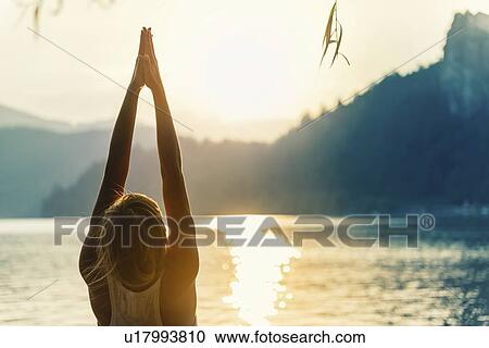 Yoga sun salutation View Large Photo Image Stock Image - Yoga sun salutation. Fotosearch