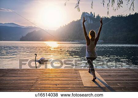 Stock Photo - Yoga sun salutation. Fotosearch