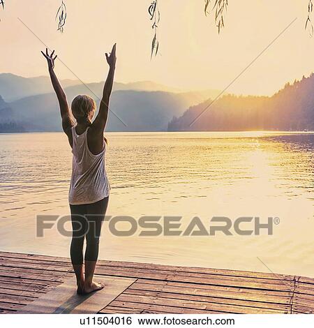 Stock Photograph - Yoga sun salutation. Fotosearch