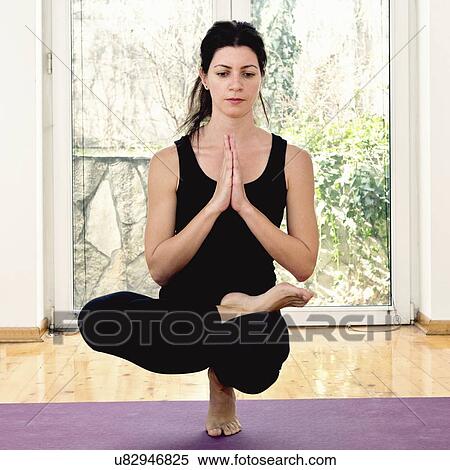 Stock Photography - Yoga toe standing. Fotosearch