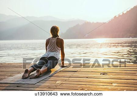 Stock Image - Yoga upward facing dog. Fotosearch