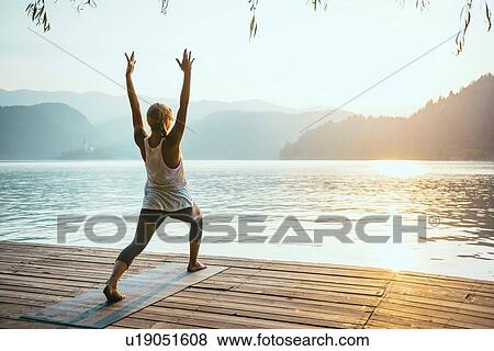 Stock Photo - Yoga warrior one pose. Fotosearch