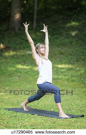 Yoga warrior one pose View Large Photo Image Stock Photography - Yoga warrior one pose. Fotosearch