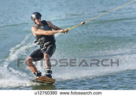 Young man wakeboarding View Large Photo Image Stock Image - Young man wakeboarding. Fotosearch