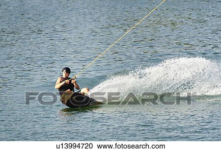 Young man wakeboarding View Large Photo Image Stock Image - Young man wakeboarding. Fotosearch