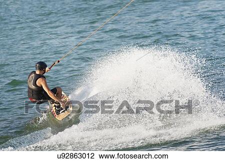 Young man wakeboarding View Large Photo Image Stock Image - Young man wakeboarding. Fotosearch
