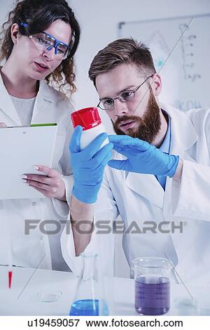 Young scientists working in laboratory View Large Photo Image Stock Photo - Young scientists working in laboratory. Fotosearch