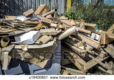 A pile of cardboard packaging waste outside industrial unit, awaiting collection. View Large Photo Image Stock Image - A pile of cardboard packaging waste outside industrial unit, awaiting collection.. Fotosearch