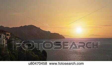 Stock Photo - Amalfi Coast at sunset in Italy. Fotosearch