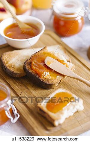 Apricot jam on toast View Large Photo Image Stock Photo - Apricot jam on toast. Fotosearch
