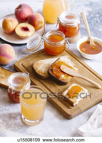Apricot jam on toast with peaches and juice View Large Photo Image Stock Photo - Apricot jam on toast with peaches and juice. Fotosearch