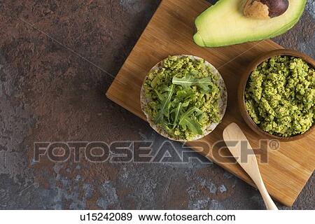Avocado on rice cake View Large Photo Image Stock Photo - Avocado on rice cake. Fotosearch