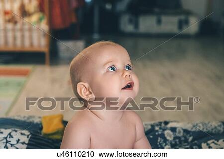 Baby girl looking up View Large Photo Image Stock Image - Baby girl looking up. Fotosearch