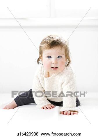 Baby girl wearing white sweater View Large Photo Image Stock Photo - Baby girl wearing white sweater. Fotosearch