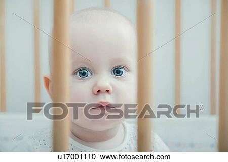 Stock Image - Baby in crib. Fotosearch