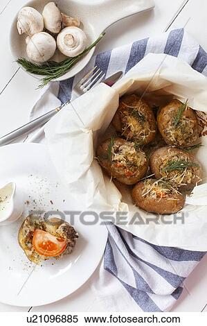Baked potatoes View Large Photo Image Stock Photography - Baked potatoes. Fotosearch
