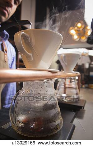 Barista by filter coffee View Large Photo Image Stock Photograph - Barista by filter coffee. Fotosearch