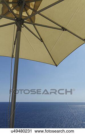 Beach umbrella by sea View Large Photo Image Stock Image - Beach umbrella by sea. Fotosearch