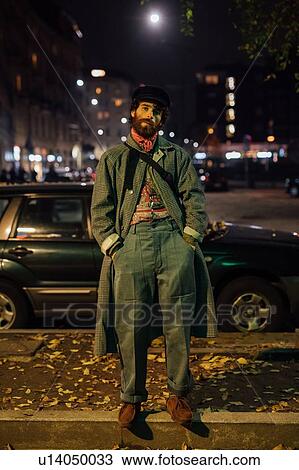 Bearded young man loitering on street View Large Photo Image Stock Image - Bearded young man loitering on street. Fotosearch