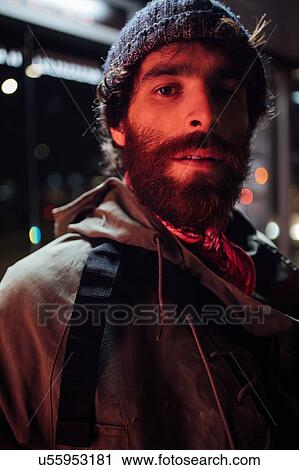 Bearded young man loitering on street View Large Photo Image Stock Image - Bearded young man loitering on street. Fotosearch