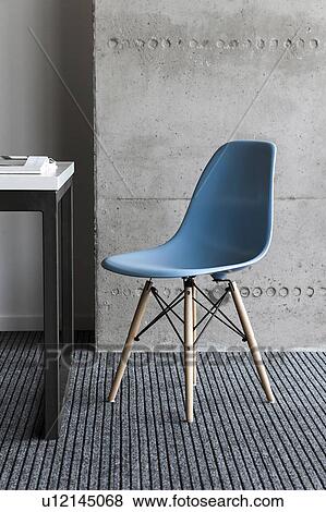 Blue chair by desk View Large Photo Image Stock Photo - Blue chair by desk. Fotosearch