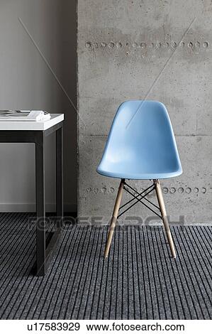 Stock Photo - Blue chair by desk. Fotosearch