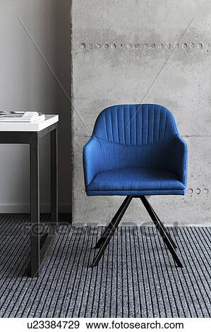 Blue chair by desk View Large Photo Image Stock Photo - Blue chair by desk. Fotosearch