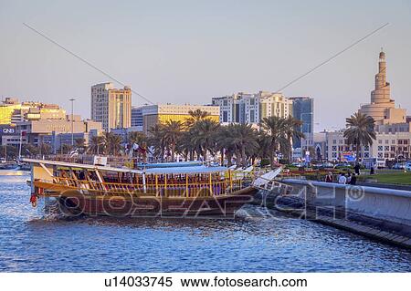 Stock Photography - Boat moored by Al Fanar Mosque in Doha, Qatar. Fotosearch