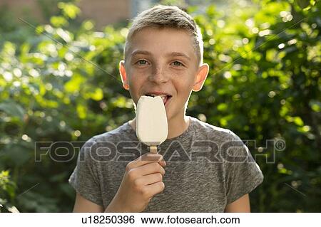 Stock Photograph - Boy eating ice cream. Fotosearch