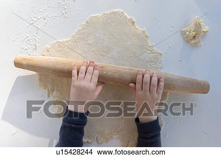 Boy's hands rolling dough View Large Photo Image Picture - Boy's hands rolling dough. Fotosearch