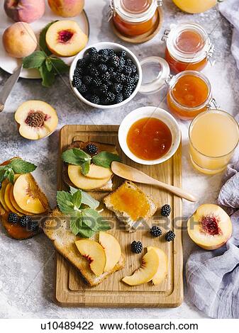Breakfast spread with blackberries, peaches, toast and apricot jam View Large Photo Image Stock Image - Breakfast spread with blackberries, peaches, toast and apricot jam. Fotosearch