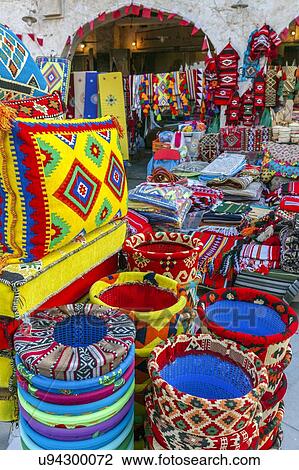 Stock Image - Bright textiles in market in Doha, Qatar. Fotosearch