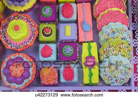 Stock Photo - Brightly colored cakes. Fotosearch