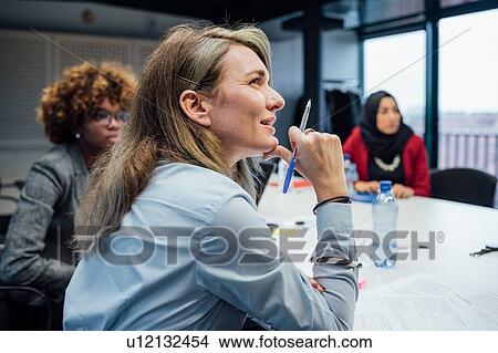 Picture - Business partners at brainstorming meeting in office. Fotosearch