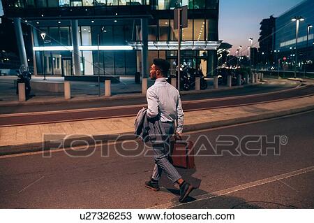 Businessman crossing road, Milano, Lombardia, Italy View Large Photo Image Stock Image - Businessman crossing road, Milano, Lombardia, Italy. Fotosearch