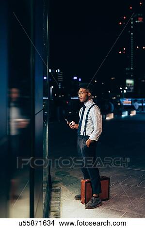Businessman looking into window of shop View Large Photo Image Picture - Businessman looking into window of shop. Fotosearch